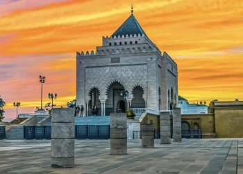 Mausoleum of Mohammed V in Rabat with traditional Moroccan white marble and green tiled roof